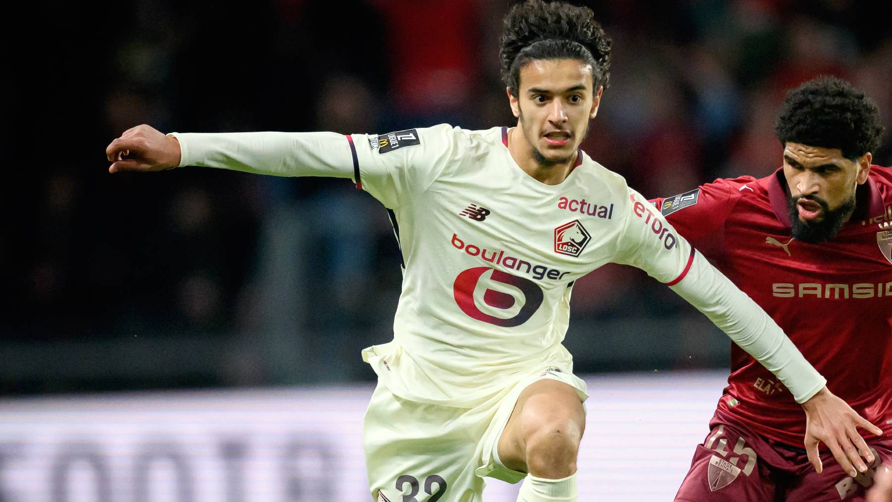 Rennes' French midfielder #45 Mahdi Camara (R) fights for the ball with Lille's French midfielder #32 Ayyoub Bouaddi during the French L1 football match between Stade Rennais and Losc Lille at the Roazhon Park stadium in Rennes, western France on March 15, 2026.