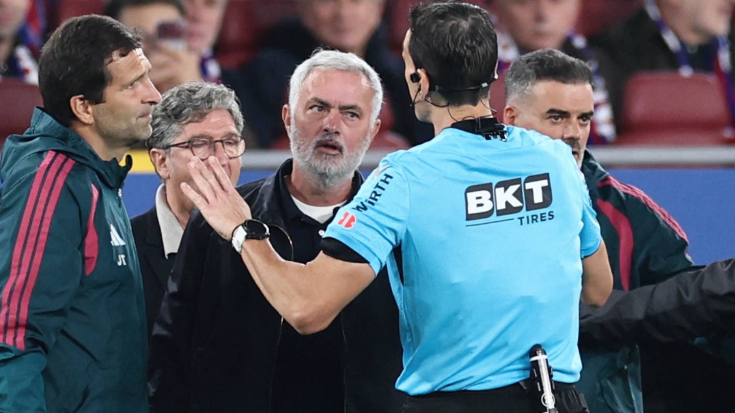 Referee Juan Martinez Munuera (R) speaks to Real Madrid's Portuguese coach Jose Mourinho during the Spanish league football match between FC Barcelona and Real Madrid CF at Camp Nou Stadium in Barcelona on October 25, 2026.