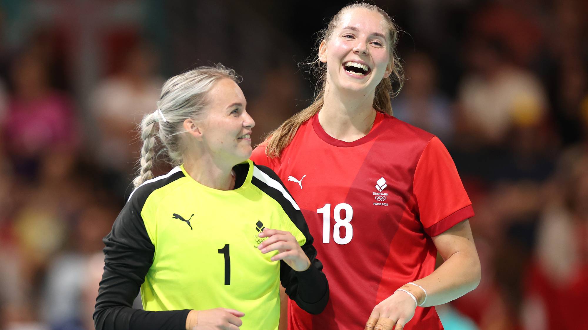 PARIS, FRANCE - AUGUST 01: Sandra Toft #1 and Mette Tranborg #18 of Team Denmark celebrate after their team defeated Team Germany during the Women’s Preliminary Round - Group A match on day six of the Olympic Games Paris 2024 at South Paris Arena on August 01, 2024 in Paris, France. (Photo by Steph Chambers/Getty Images)