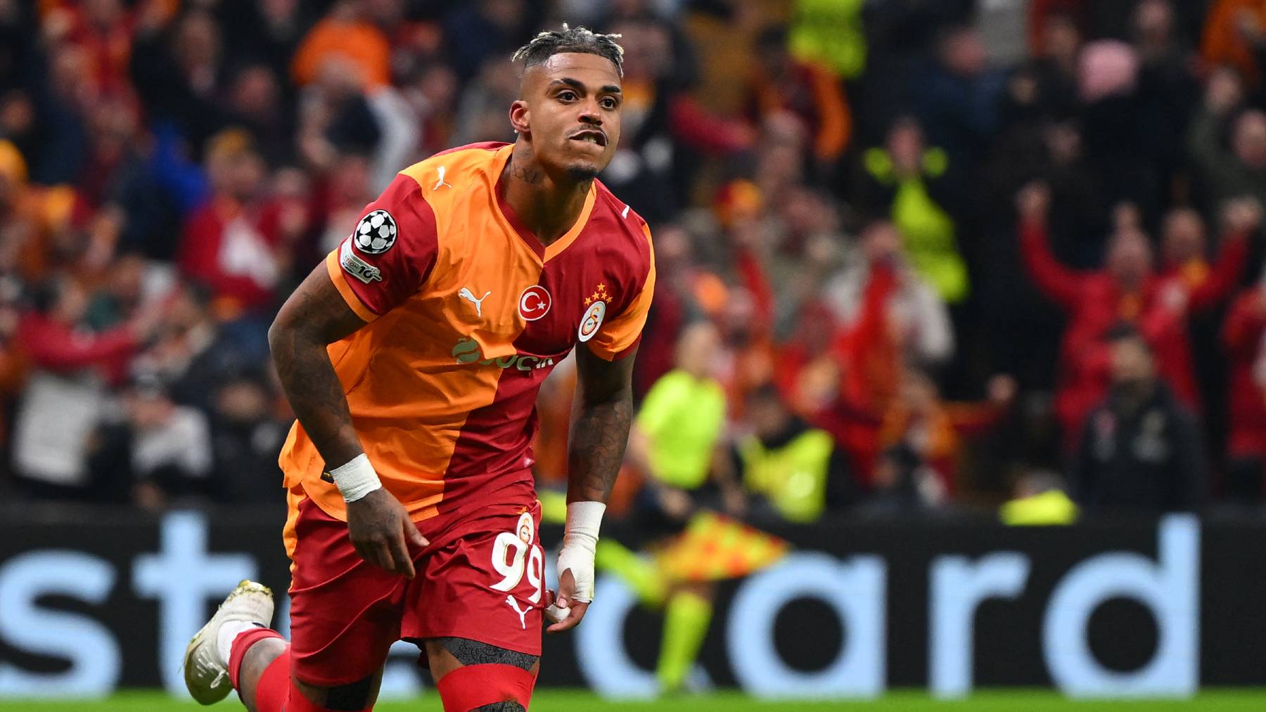 Galatasaray's Gabonese midfielder #99 Mario Lemina celebrates after scoring the opening goal during the UEFA Champions League round of 16 first leg football match between Galatasaray SK and Liverpool FC at the Ali Sami Yen Sports Complex in Istanbul on March 10, 2026.